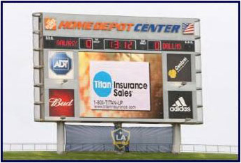 Home Depot Center stadium scoreboard ads for Titan Insurance, ADT, Budweiser, and Adidas
