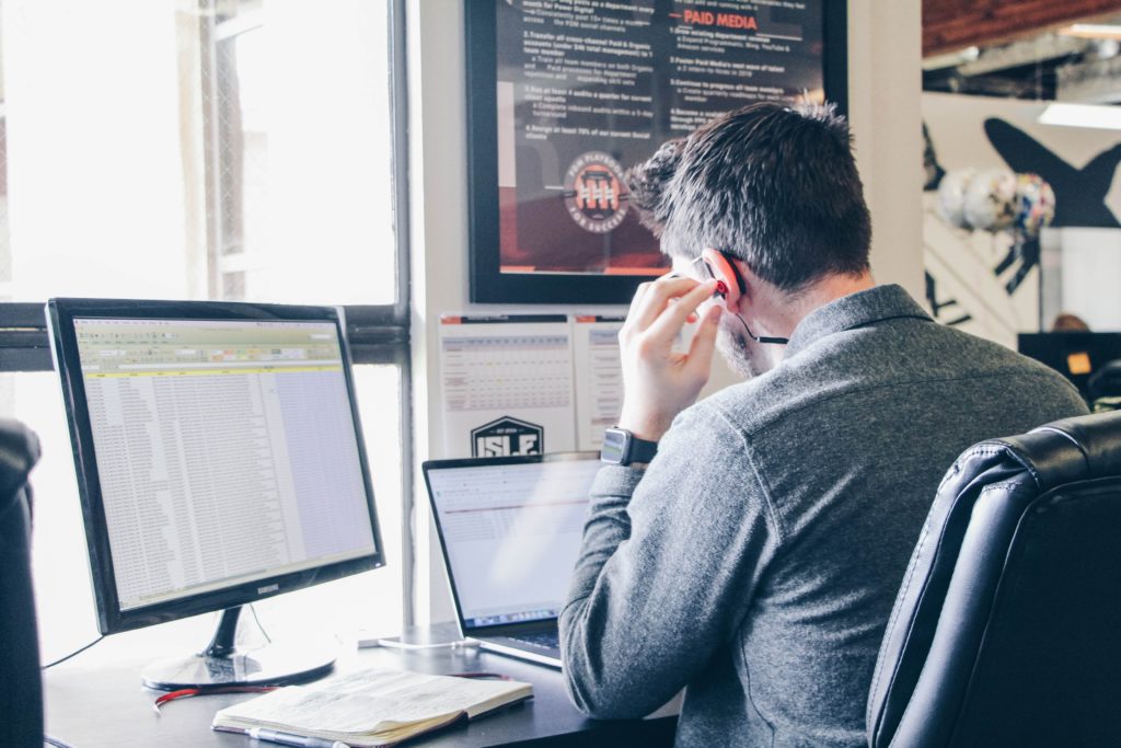 a man sitting at a computer