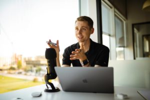 Man at desk talking