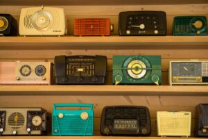 vintage radios on brown shelf