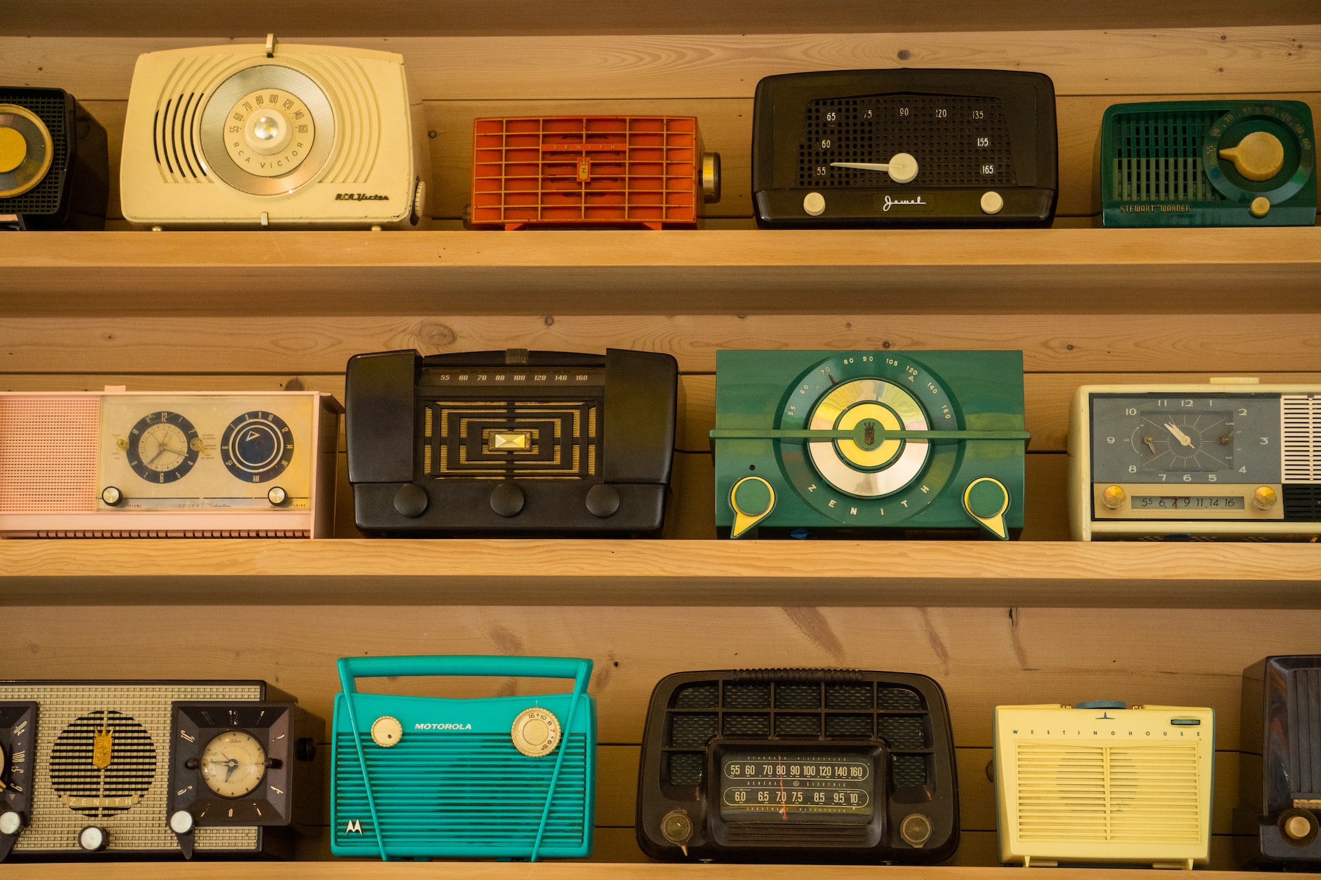 vintage radios on brown shelf